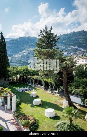 The stunning garden of Villa Eva in the town of Ravello Italy. A renowned wedding venue and privately owned villa. Landscaped garden and tall trees. Stock Photo