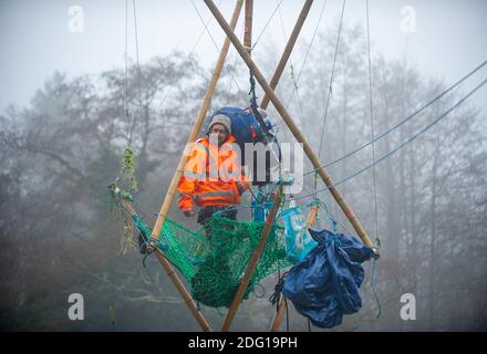 Denham, Buckinghamshire, UK. 7th December 2020. Veteran eco activist Dan Hooper known as Swampy is currently locked onto a huge bamboo structure in the River Colne in Denham. Activists put the 'beacon of truth' in place early this morning. HS2 have already felled many mature trees in Denham Country Park ahead of the bridge construction. Anti HS2 Rebellion activists at the Denham Ford Wildlife Protection Camp are are trying to stop the bridge from going across the River Colne today and further woodland destruction by HS2. Credit: Maureen McLean/Alamy Live News Stock Photo