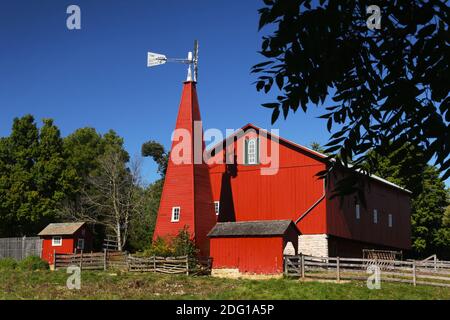 Historic Red Barn. The barn was built in the 1880's and featured a unique enclosed windmill tower. Carriage Hill Metropark, Huber Heights or Dayton, O Stock Photo