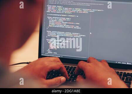 Selective focus of Programming Work and Typing New Lines of Code. Laptop and Hand Closeup. Working Time. Web Design Business Concept. Stock Photo