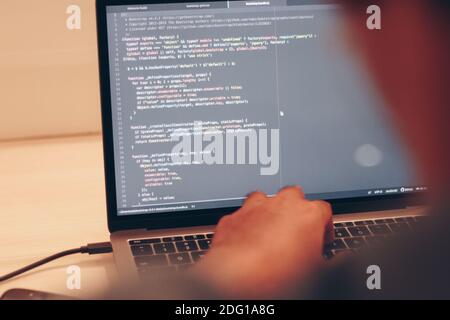 Selective focus of Programming Work and Typing New Lines of Code. Laptop and Hand Closeup. Working Time. Web Design Business Concept. Stock Photo