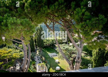 The stunning garden of Villa Eva in the town of Ravello Italy. A renowned wedding venue and privately owned villa. Landscaped garden and tall trees. Stock Photo