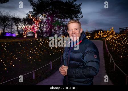 UK, Gloucestershire, Temple Guiting, Cotswold Farm Park, BBC Countryfile presenter and farmer Adam Henson in Enchanted Light Trail Stock Photo