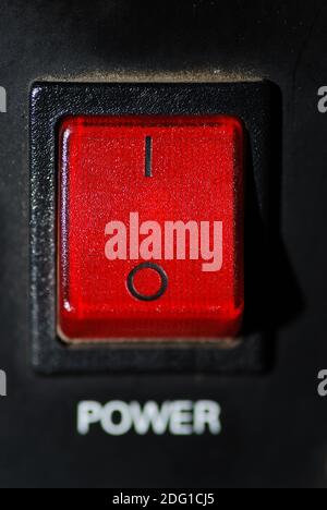 Power switch has been switched on and is illuminated red Stock Photo