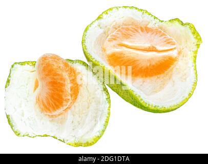 Peeled Mandarine fruit pieces   (clementine, tangerin) slices  isolated on white background. Top view. Flat lay Stock Photo