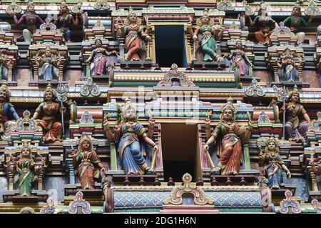 Colorful  holy figure on the facade outside from the hindu Temple in Malaysia. Stock Photo