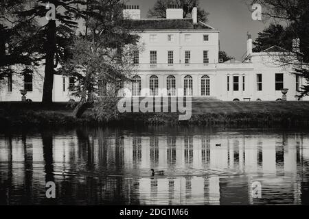 Frogmore House viewed across the lake, Windsor. Berkshire. England. UK Stock Photo