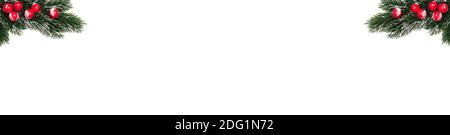 Decorative Christmas snowy frosted fir twigs with red berries sticking out in the corners. Isolated on white background. Christmas card, winter holida Stock Photo