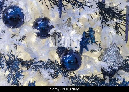 White Christmas tree with blue ornaments, USA Stock Photo