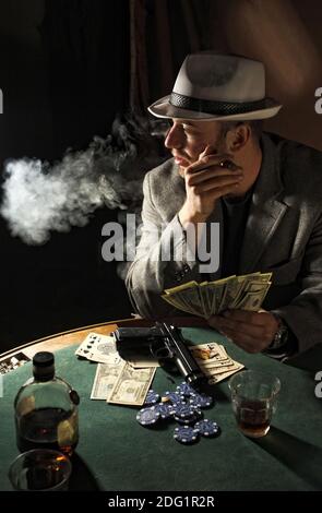 Gangster smoking and play poker Stock Photo