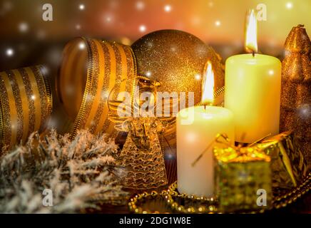 Angel and shiny candles on Christmas Eve Stock Photo