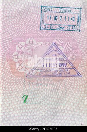 UK passport page with 1999 Indonesia entry/exit stamp and 2002 Czech Republic stamp (Prague Airport) Stock Photo