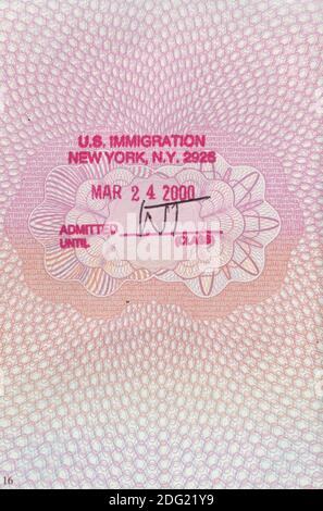 UK passport page with a US immigration entry stamp from JFK Airport, New York, from year 2000 Stock Photo