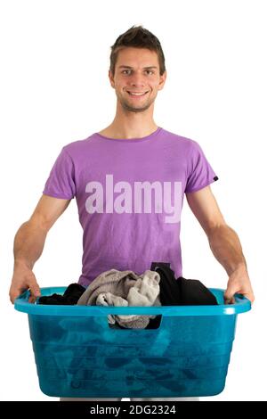 Young man doing the laundry Stock Photo