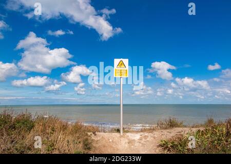 A sign on the Kent coast near Margate warns of an unfenced cliff Stock Photo