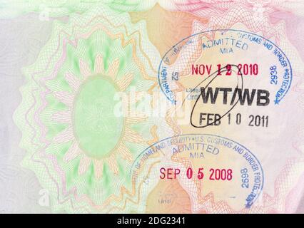 UK passport page with entry stamps from Miami international airport, from 2008 (transit stamp) and 2010 (tourist entry stamp) Stock Photo