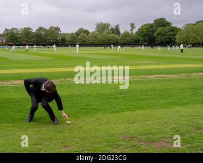 A cricket match in progress at Eton College on the fourth of June celebration day. Stock Photo