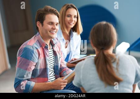Group of students studying together in the campus Stock Photo