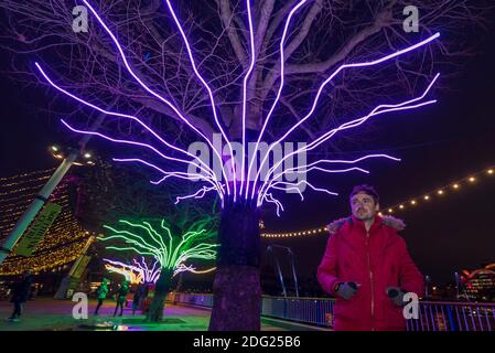 London, UK.  7 December 2020. Artist David Ogle in front of his work 'Lumen', trees illuminated with glowing neon flex. Preview of “Winter Light” presented by Southbank Centre.  Over 15 artworks and new illuminated commissions by a range of leading international artists are on display around the site’s buildings and the Riverside Walk until the end of February 2021. Credit: Stephen Chung / Alamy Live News
