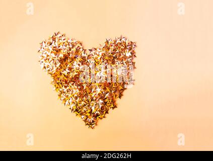 Colorful confetti heart on soft pastel background. Stock Photo
