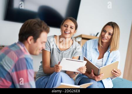 Group of students studying together in the campus Stock Photo