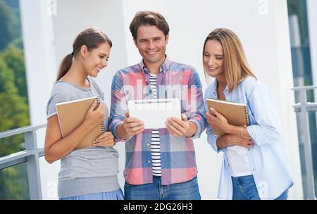 Group of students studying together in the campus Stock Photo