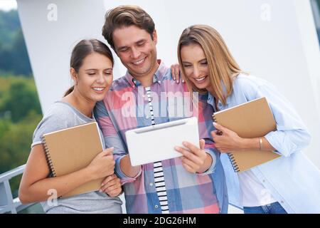 Group of students studying together in the campus Stock Photo