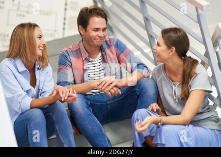 Group of students relaxing in the campus Stock Photo