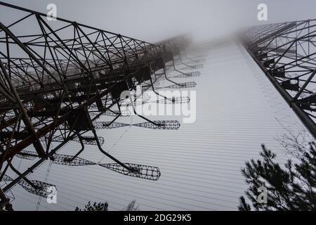 Soviet radar Duga in foggy weather. Russian woodpecker - over-the-horizon radar station near Chernobyl Stock Photo