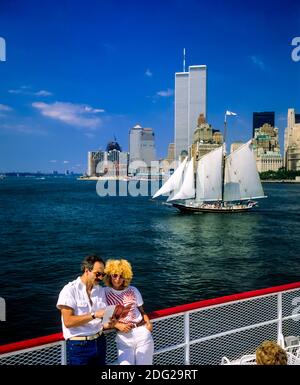 New York 1985, tourists couple, river cruise, Pioneer schooner sailboat, WTC World Trade Center twin towers, Manhattan, New York City, NY, NYC, USA,