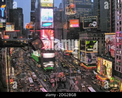 NEW YORK CITY - AUG 11: Times Square ,is a busy tourist intersection of neon art and commerce and is an iconic street of New Yor Stock Photo