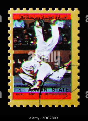 MOSCOW, RUSSIA - NOVEMBER 10, 2018: A stamp printed in Ajman shows Wrestling, Summer Olympics serie, circa 1973 Stock Photo