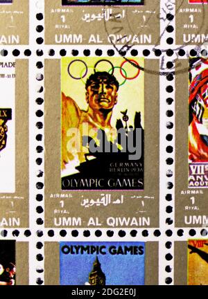 MOSCOW, RUSSIA - NOVEMBER 10, 2018: A stamp printed in Umm al-Qaiwain shows Berlin, 1936, History of the Olympic Games serie, circa 1972 Stock Photo