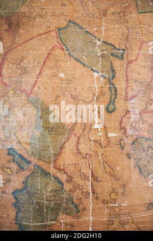 An old wall map with detail of Blue Hill, Sedgwick and Brooklin of local Hancock County hangs at the restored Surry Village School. In Surry, Maine. Stock Photo