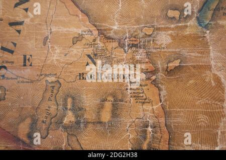 An old wall map with details of Bar Harbor of local Hancock County hangs at the restored Surry Village School. In Surry, Maine. Stock Photo