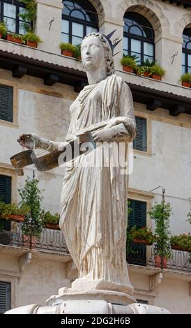 Statue of Madonna Verona, one of the symbols of the city, at the center of Piazza delle Erbe in Verona, Italy Stock Photo