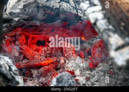 Smouldering embers of burning wood, closeup in details Stock Photo