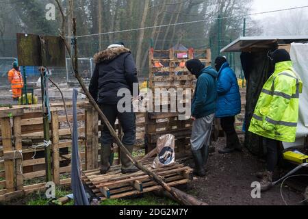 Denham, UK. 7th December, 2020. Anti-HS2 activists build a barricade at Denham Ford Protection Camp adjacent to a site where HS2 are trying to build a bridge across the river Colne. Activists continue to resist the controversial £106bn high-speed rail project from a series of protest camps based along its initial route between London and Birmingham. Credit: Mark Kerrison/Alamy Live News Stock Photo