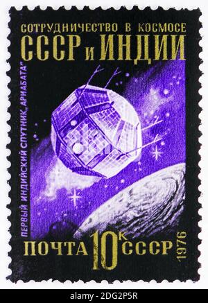 MOSCOW, RUSSIA - NOVEMBER 10, 2018: A stamp printed in USSR (Russia) shows Satellit Ariabata, Interkosmos Program serie, circa 1976 Stock Photo