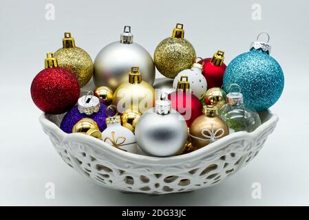 Christmas balls tree inside a white  ceramic bowl. Traditional Christmas ornament Stock Photo