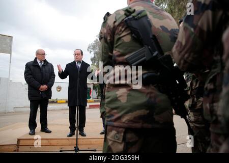 French President Francois Hollande, right, flanked by French defense minister Jean-Yves Le Drian addresses French soldiers at the Iraqi Counter Terrorism Service Academy on the Baghdad Airport Complex in Baghdad, Iraq, Monday, January 2, 2017. Hollande is in Iraq for a one-day visit. The soldiers are part of a task force to assess and advise Iraqi security forces under the command of international military instructors. Photo by Christophe Ena/Pool/ABACAPRESS.COM Stock Photo