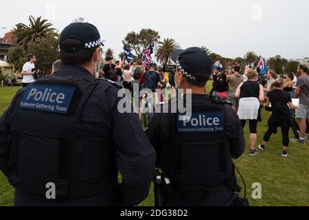 Melbourne, Australia, 5 December, 2020. Victoria Police's Evidence Gathering Unit quietly films the protest during the Sack Daniel Andrews Protest in St Kilda. Parts of the community are looking to hold the Victorian Premier accountable for the failings of his government that led to more than 800 deaths during the Coronavirus crisis. Victoria has recorded 36 days Covid free as pressure mounts on the Premier Daniel Andrews to relax all remaining restrictions. Credit: Dave Hewison/Alamy Live News Stock Photo