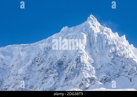 Aiguille du midi covered in fresh snow stunning view from chamonix France. High quality photo Stock Photo