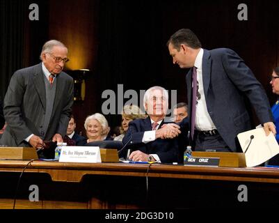 United States Senator Ted Cruz (Republican of Texas), right shakes hands with Rex Wayne Tillerson, former chairman and chief executive officer of ExxonMobil, as he appears before the US Senate Committee on Foreign Relations considering his the nomination to be Secretary of State of the US on Capitol Hill in Washington, DC on Wednesday, January 11, 2017. Former US Senator Sam Nunn (Democrat of Georgia) looks on from left.Credit: Ron Sachs / CNP Stock Photo