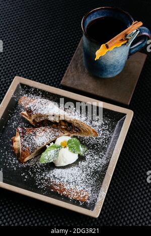 various desserts with tea on a black background Stock Photo