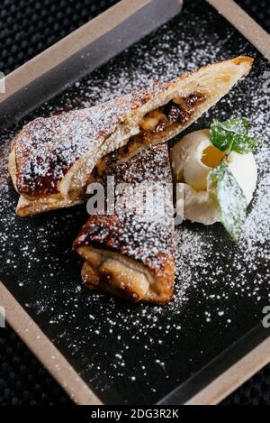 various desserts with tea on a black background Stock Photo