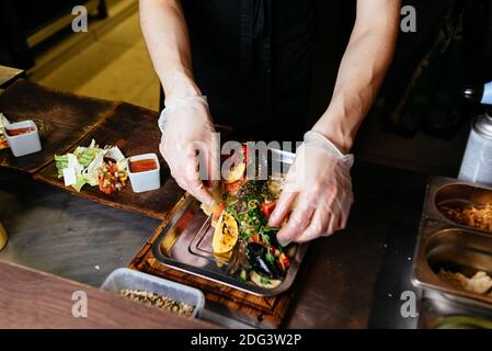 the process of serving and cooking Dorado fish Stock Photo