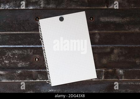 Memo, from squared paper with copy space against a metal background. Stock Photo