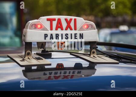 Taxi sign on a Parisian taxi