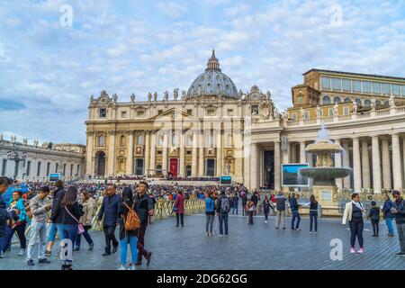 Tourists and Belivers in Saint Peters Square on sunday Stock Photo